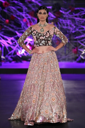 Another Manish Malhotra outfit which I think totally suits the sister! A sexy floral printed choli with shimmery lehenga, a perfect ensemble for a night wedding!